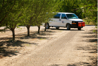 CalVans vehicle turns off road into orchard